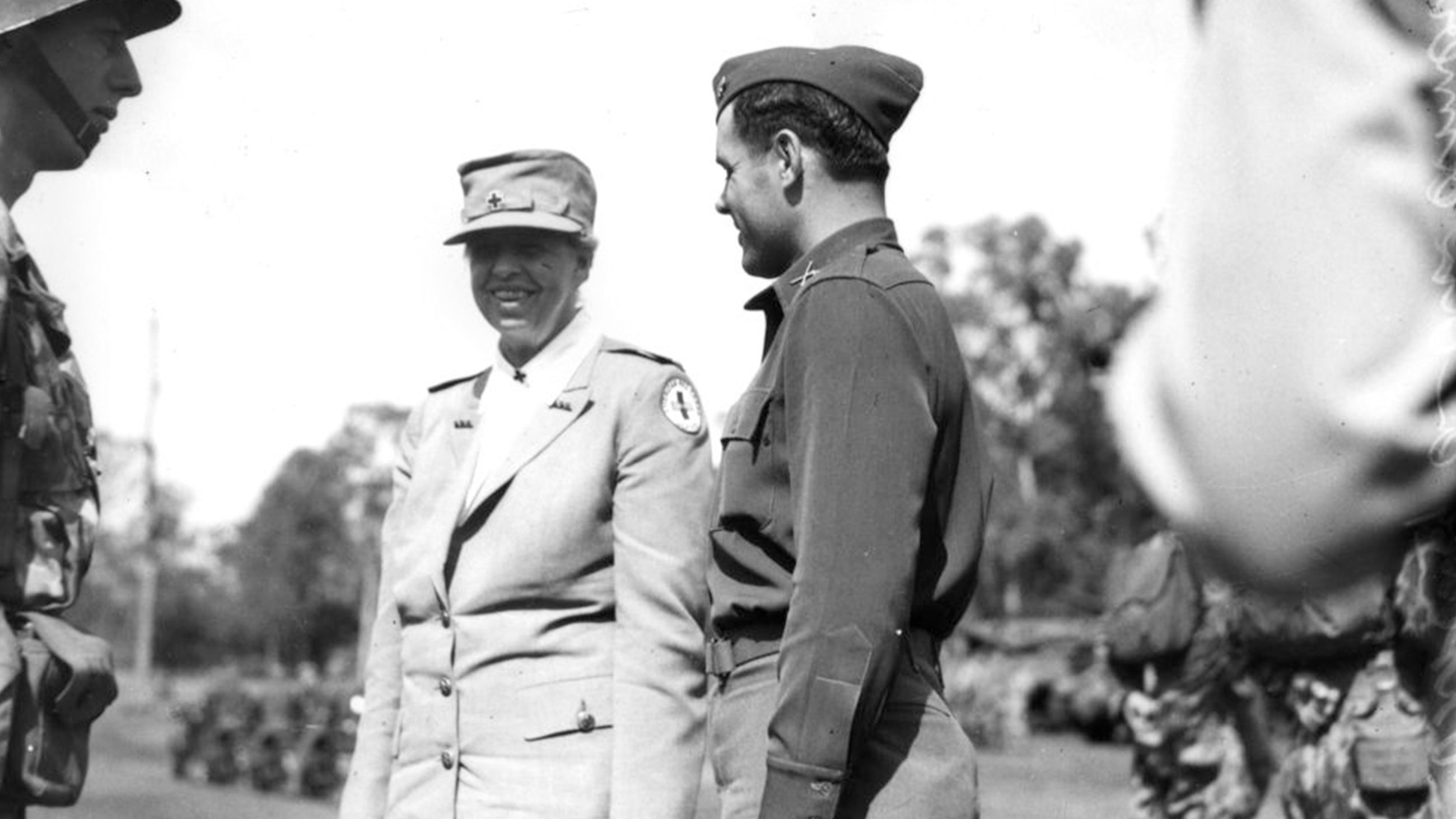 Eleanor Roosevelt smiling and meeting with US troops in Brisbane.